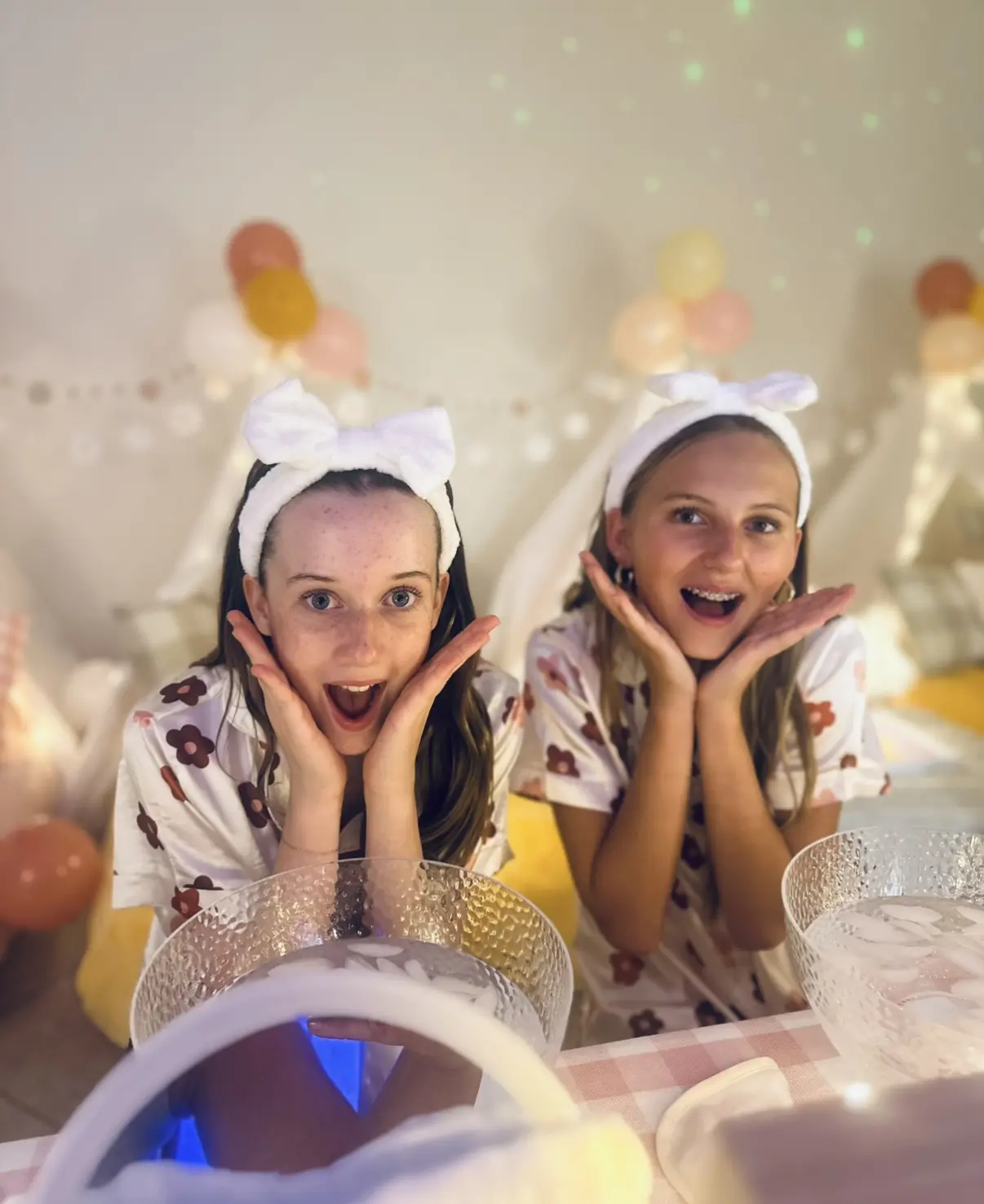 Two girls with white headbands at spa party