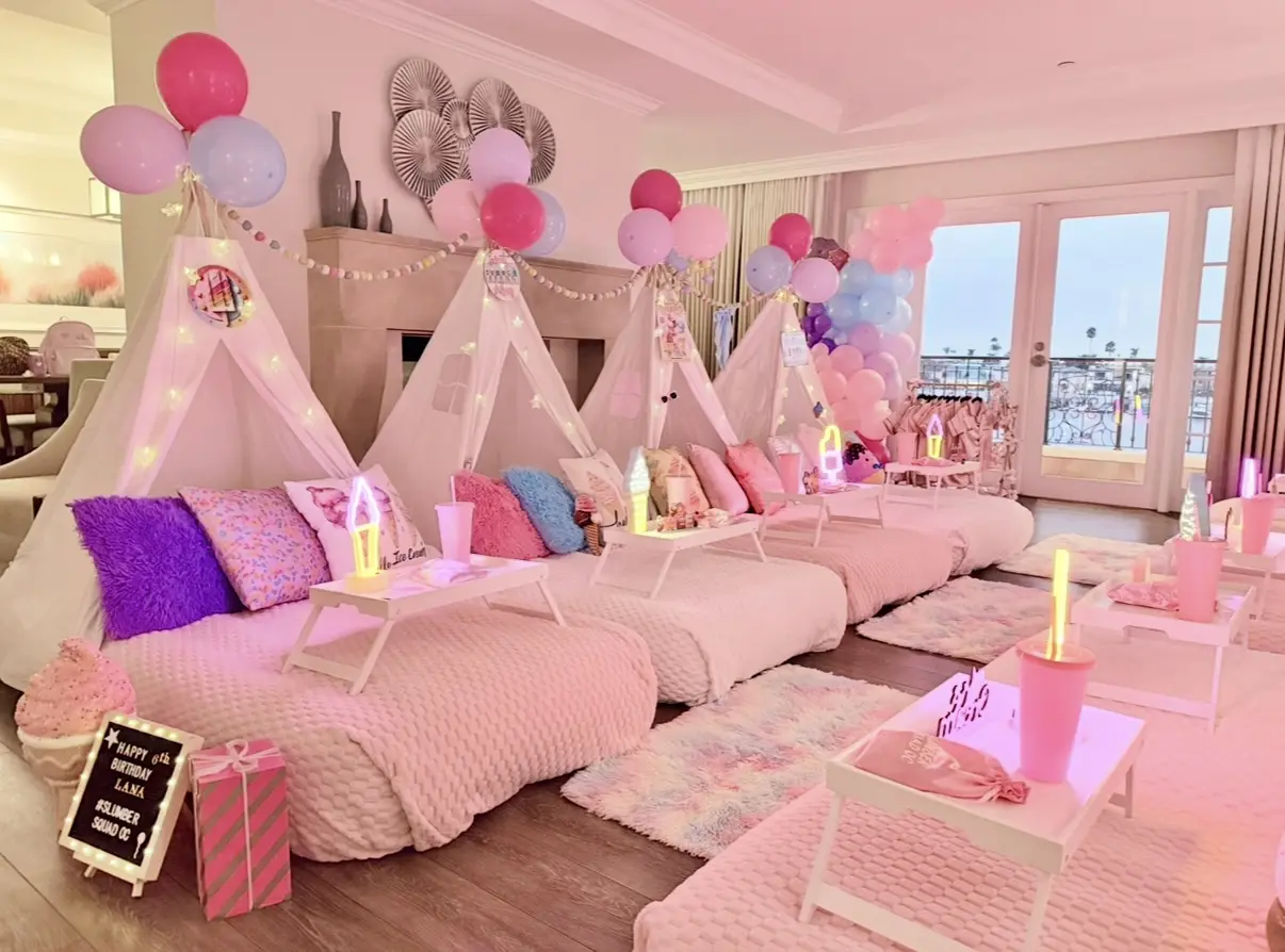 Pastel pink indoor teepee sleepover party scene