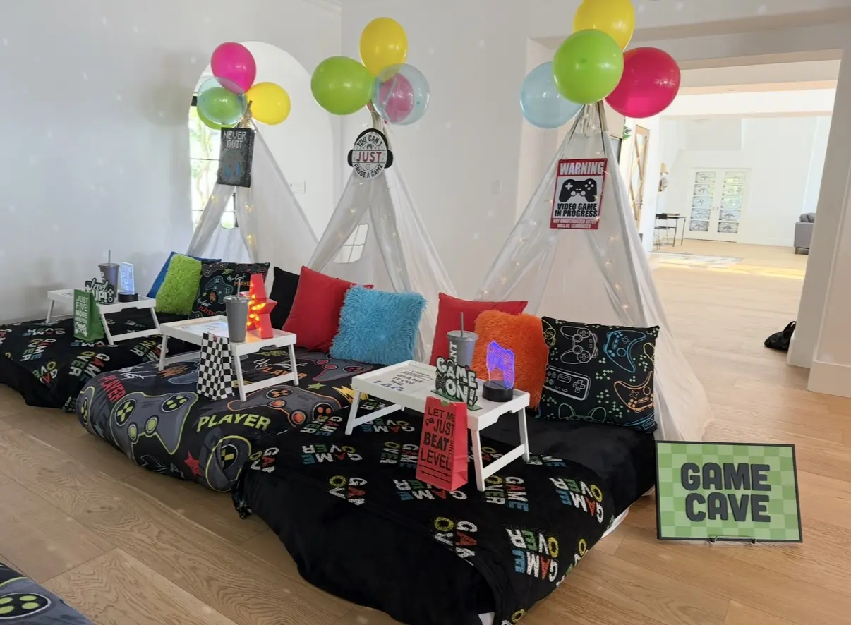Gaming-themed teepee sleepover with balloons