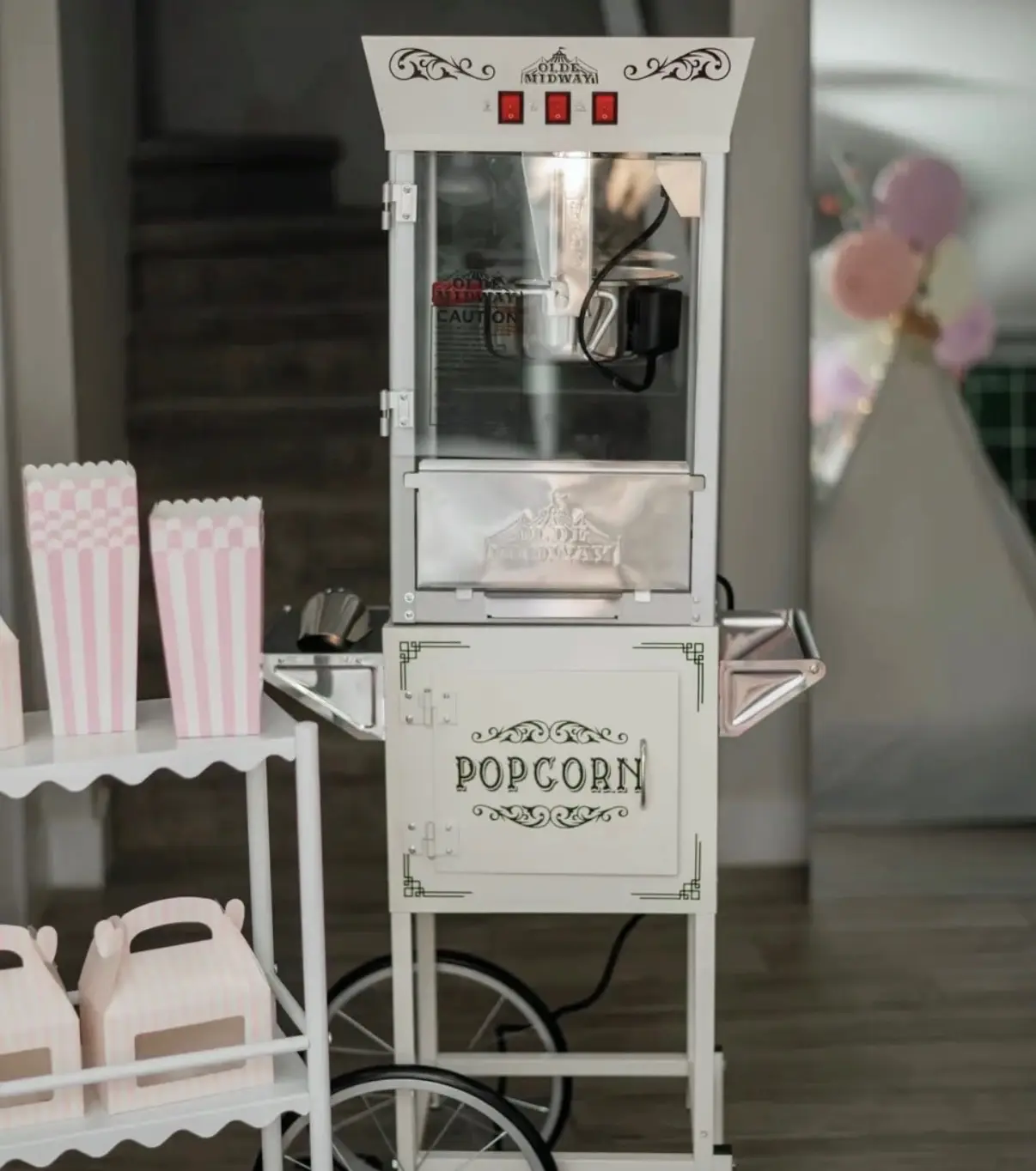 Antique style popcorn cart with pastel decor
