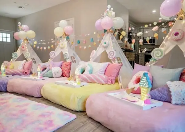 Pastel indoor slumber party tents and pillows