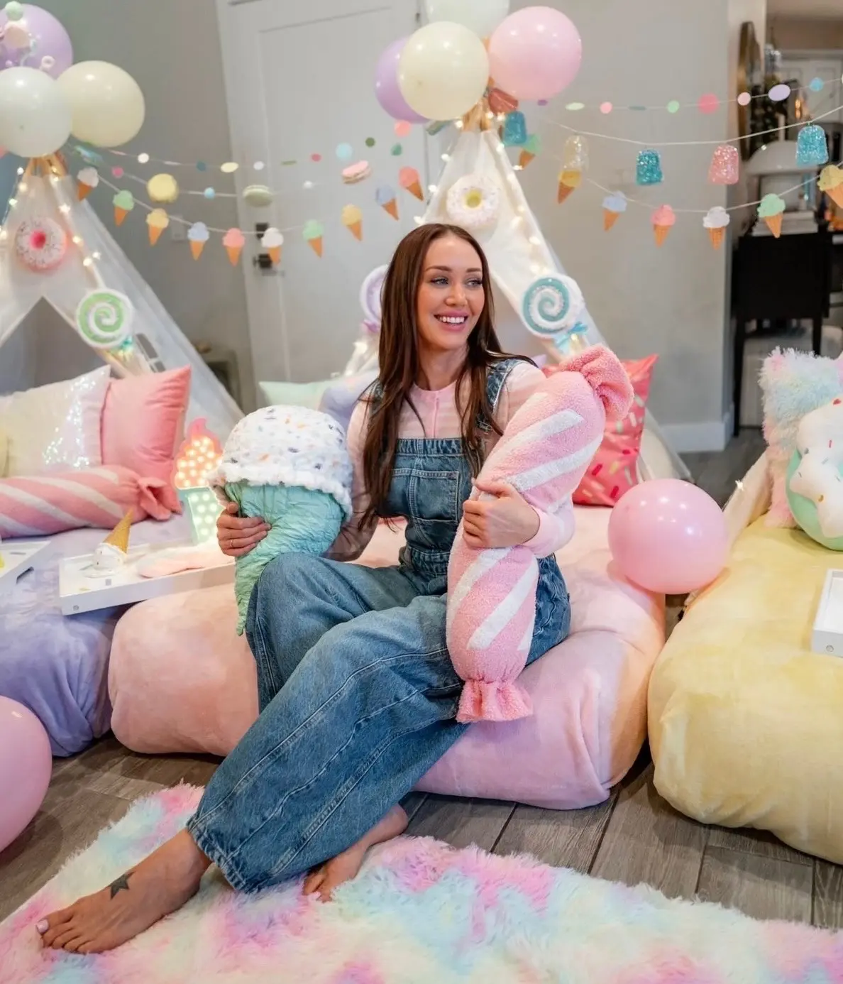 Smiling woman at pastel-themed slumber party