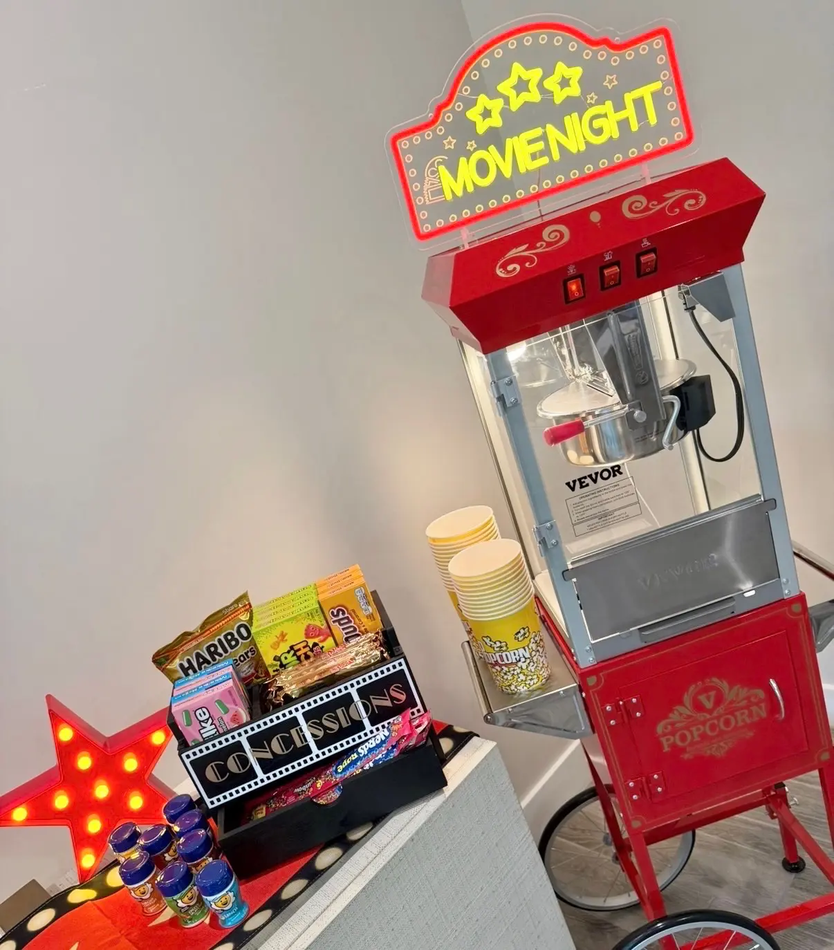 Retro red popcorn cart with movie snacks