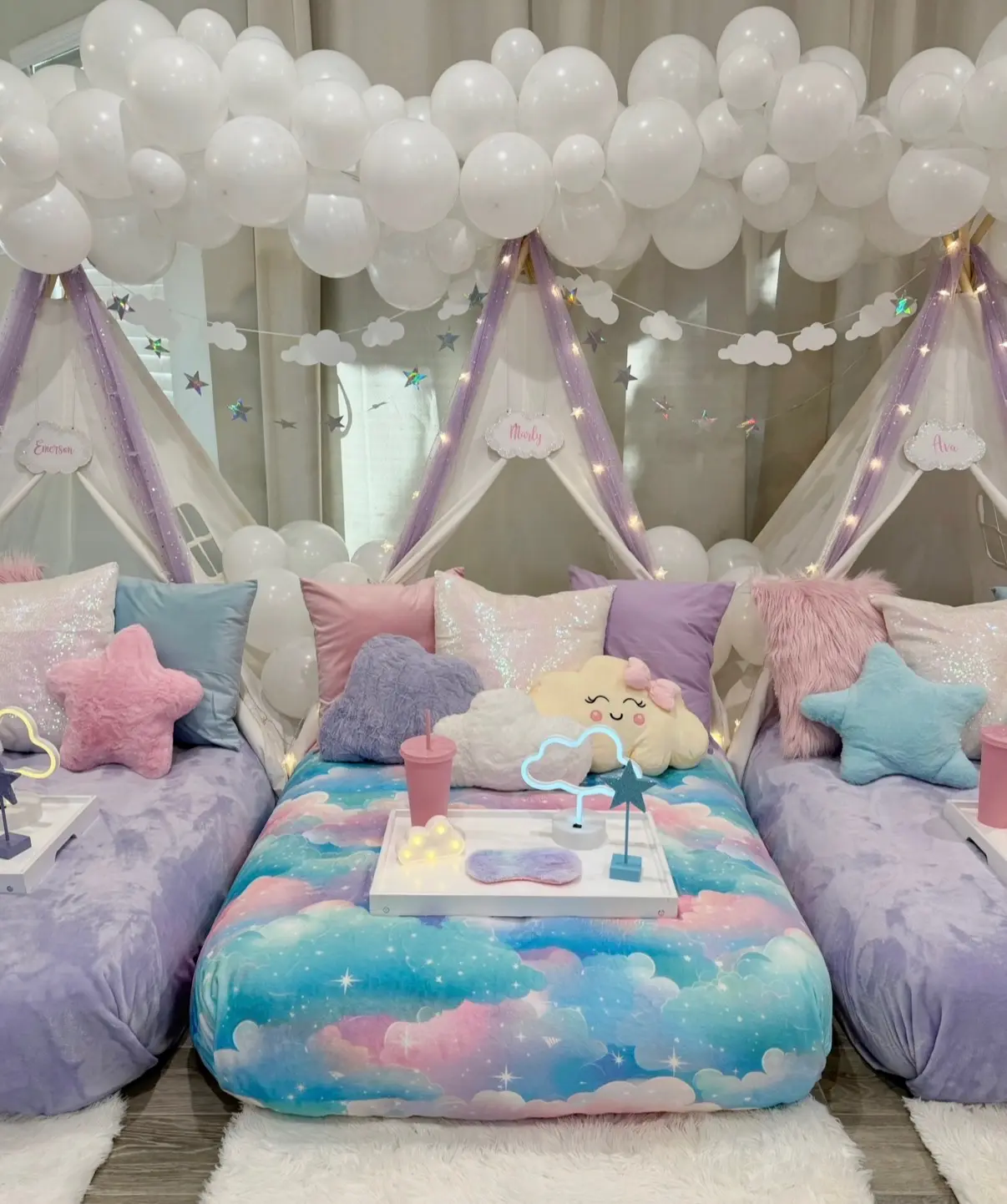 Pastel cloud themed sleepover bed setup