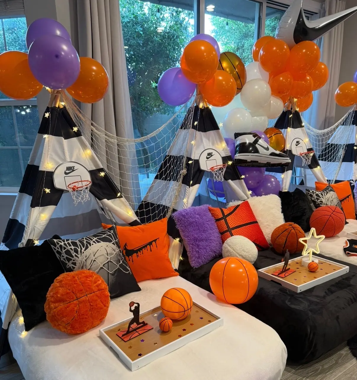 Basketball teepee party setup with orange balloons