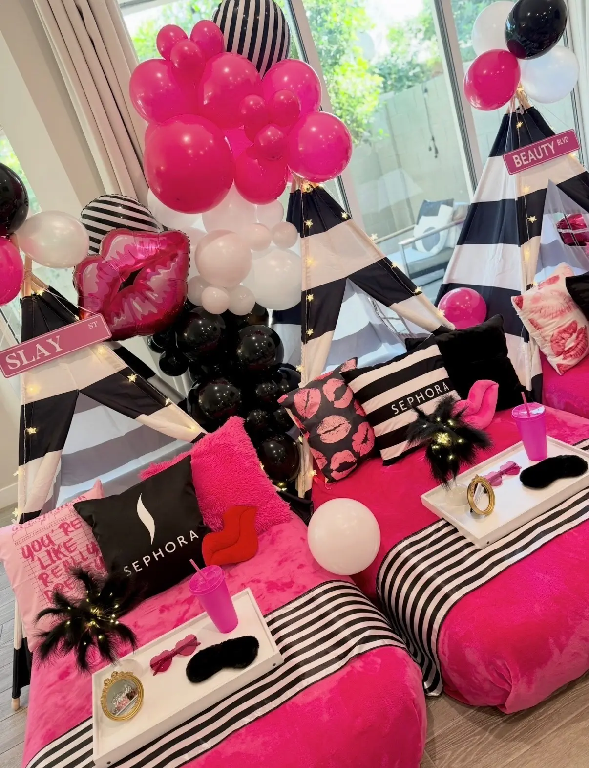 Sephora-inspired pink and black sleepover decor