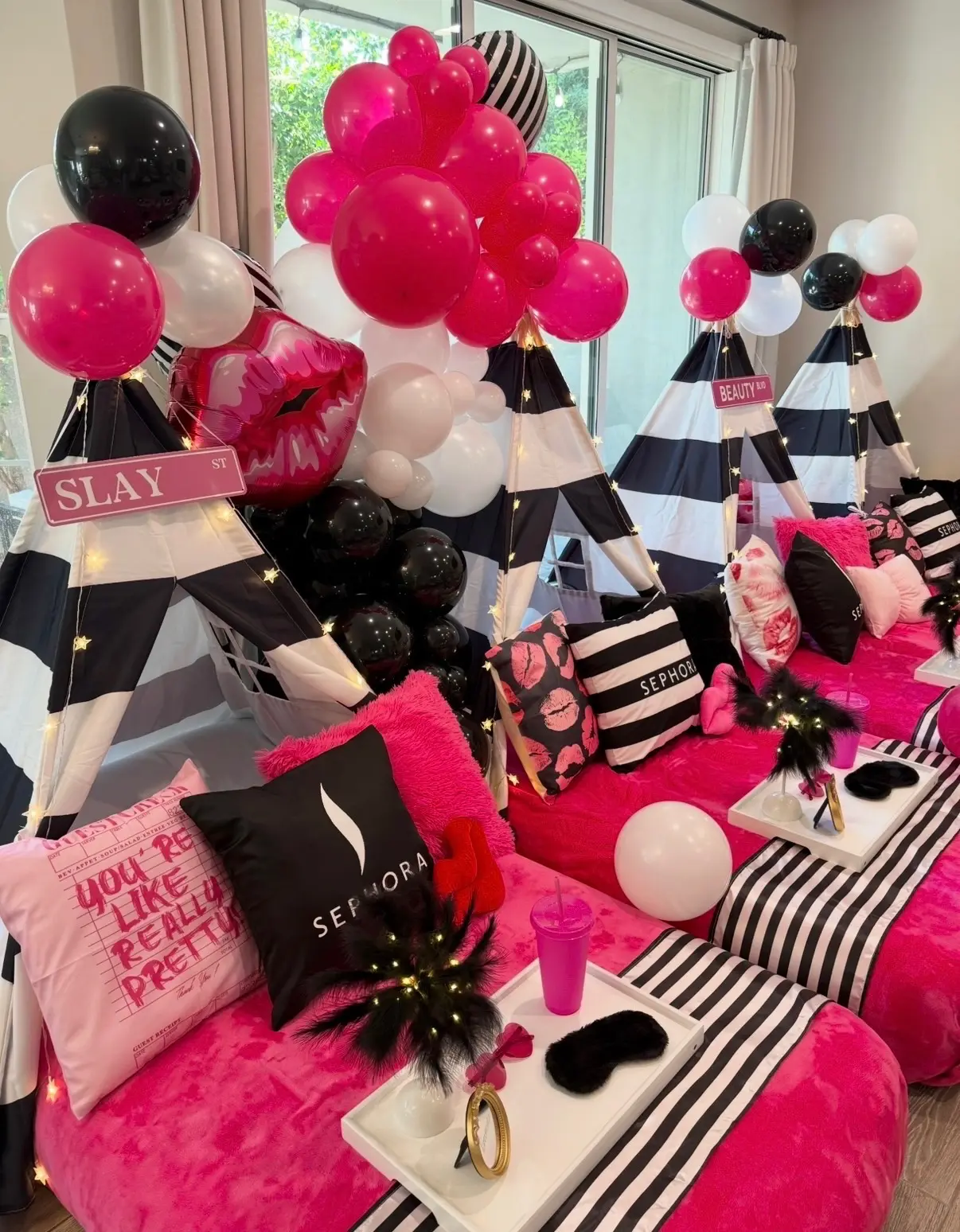 Glam pink black sleepover teepees with balloons