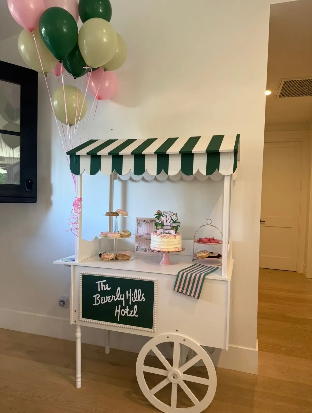 Beverly Hills themed dessert cart with balloons