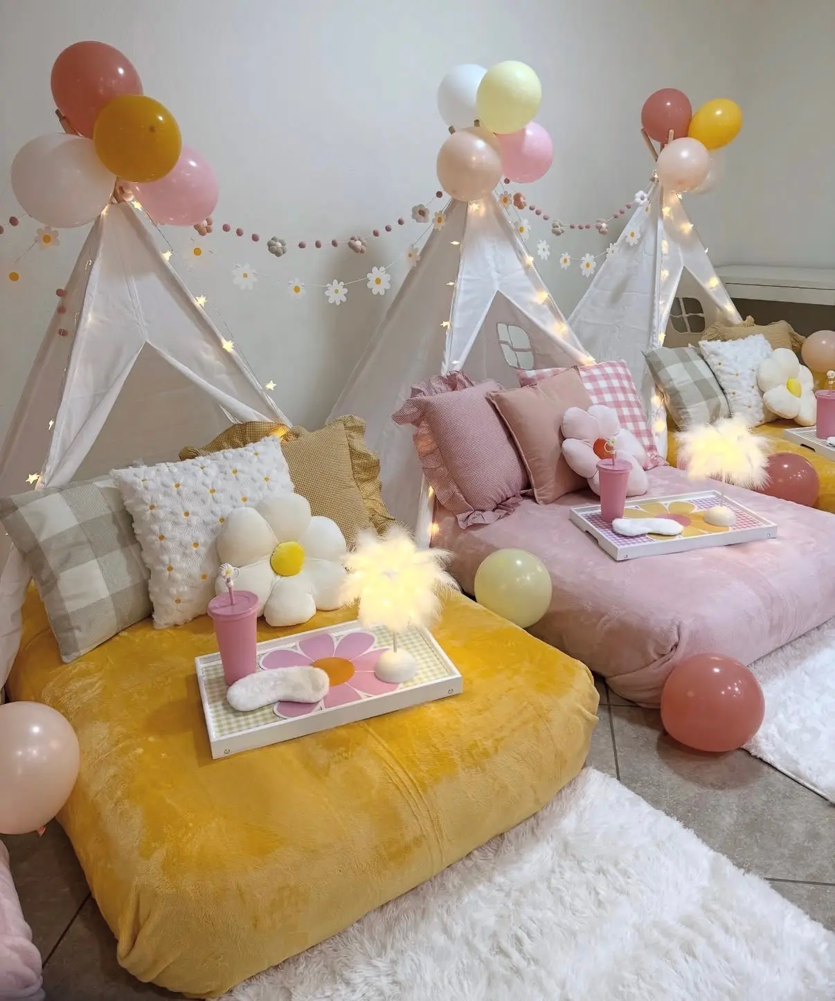 Cozy pastel teepee sleepover setup