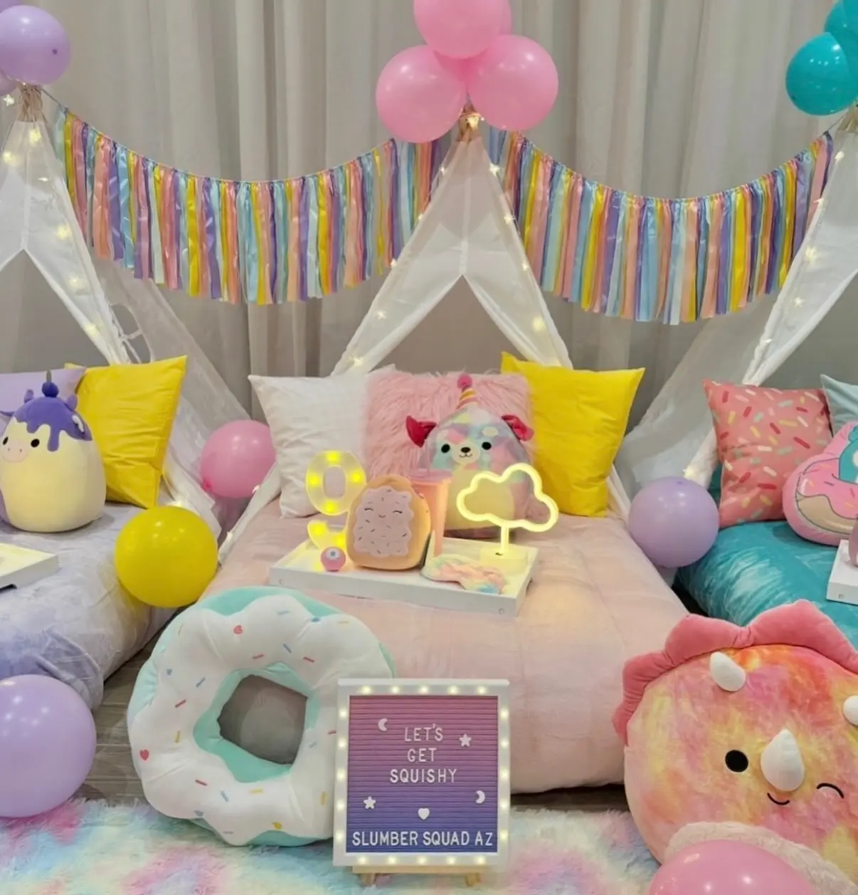 Pastel slumber party tents with plush toys