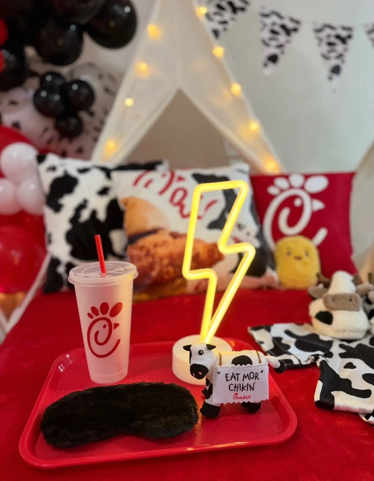 Chick-fil-A cup and cow plush on tray