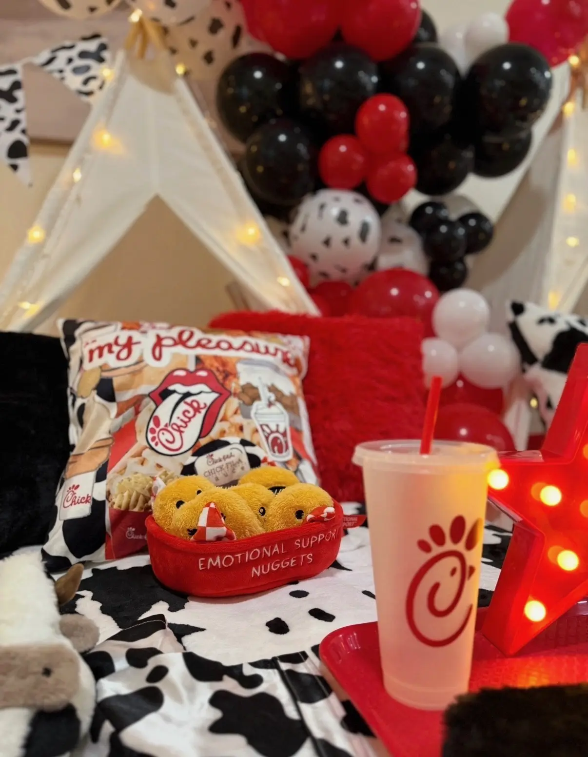 Chick‑fil‑A themed cozy setup with plush nuggets