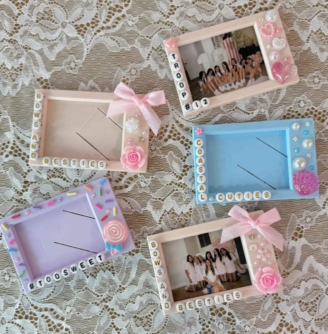 Pastel decorated photo frames on lace