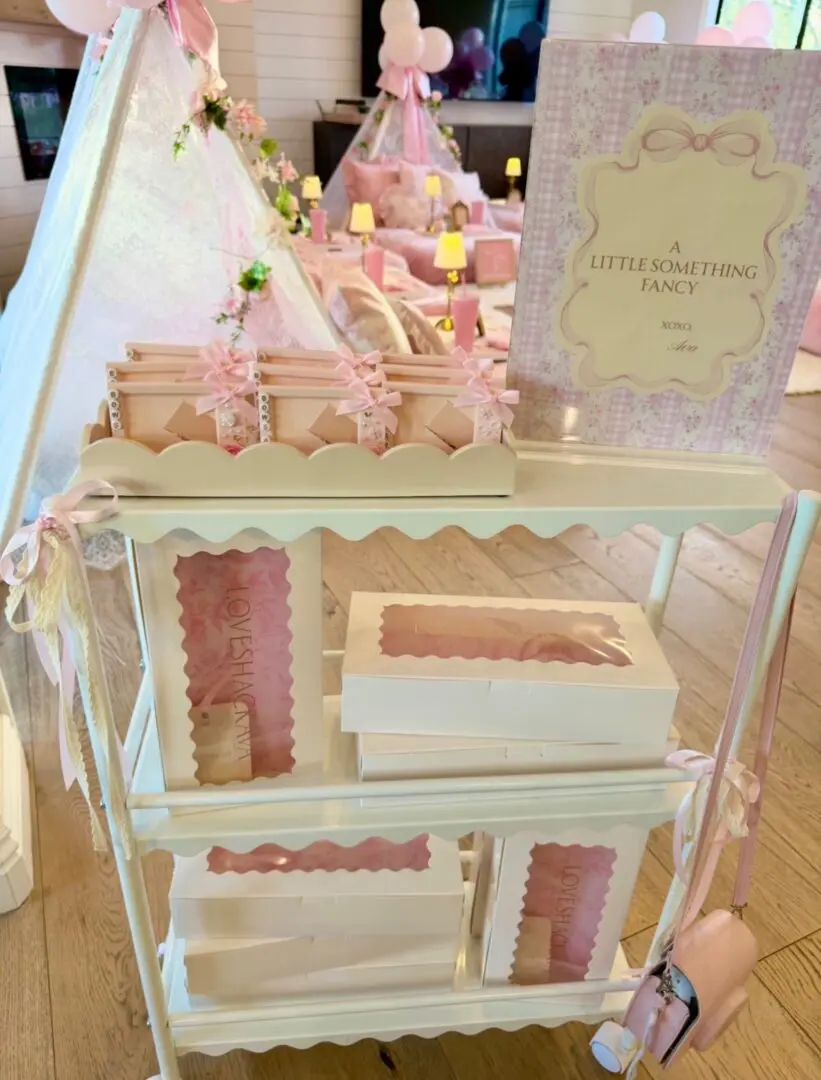 Pastel pink and white party favor display