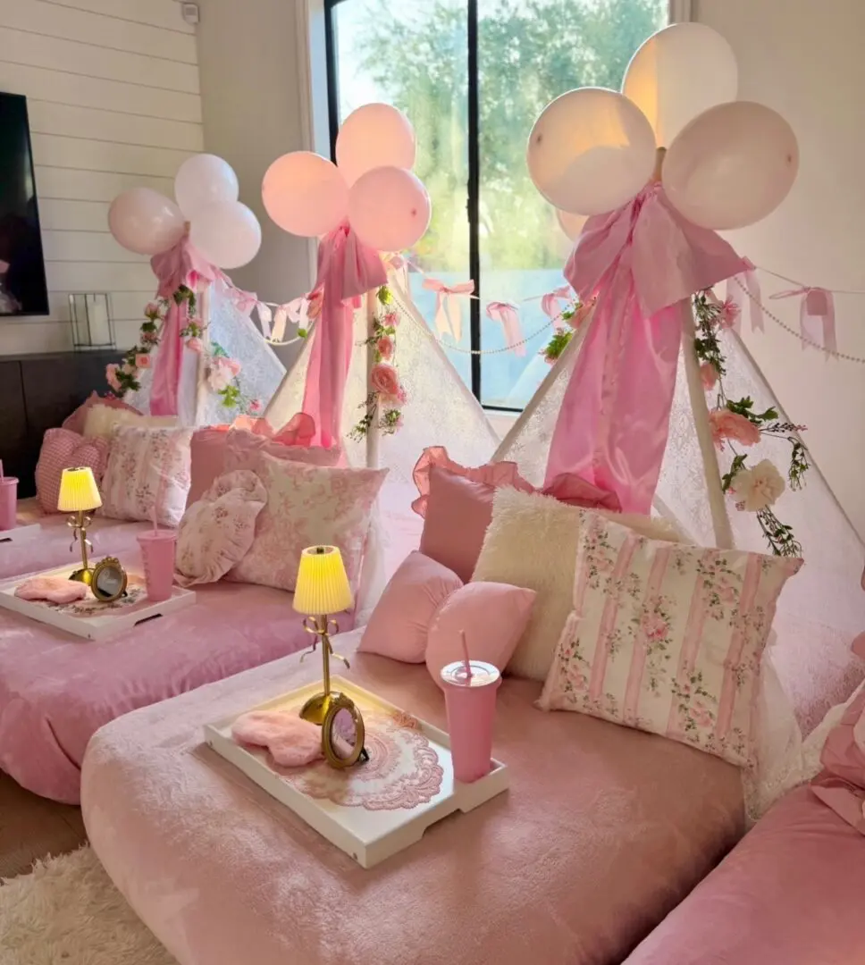 Pink indoor teepee slumber party setup