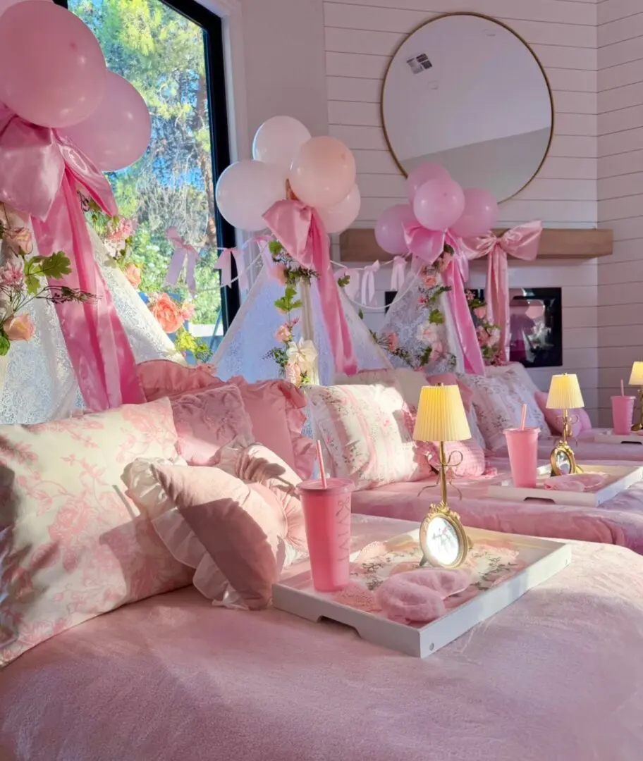Pink princess sleepover setup with balloons
