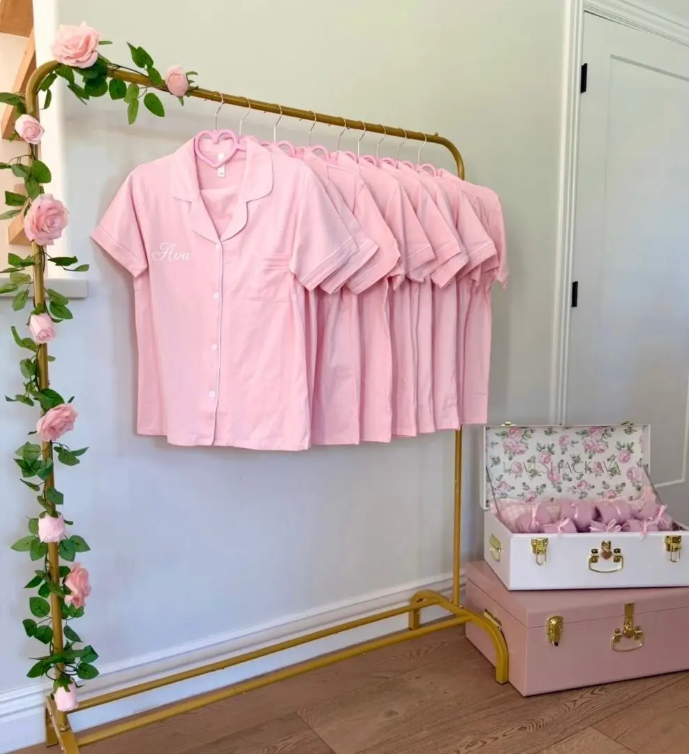 Pink matching pajamas on gold rack