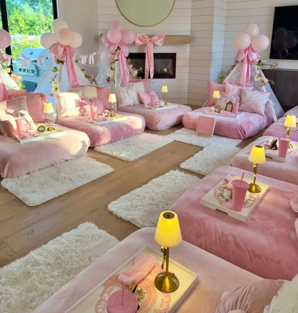 Pink sleepover setup with canopy beds