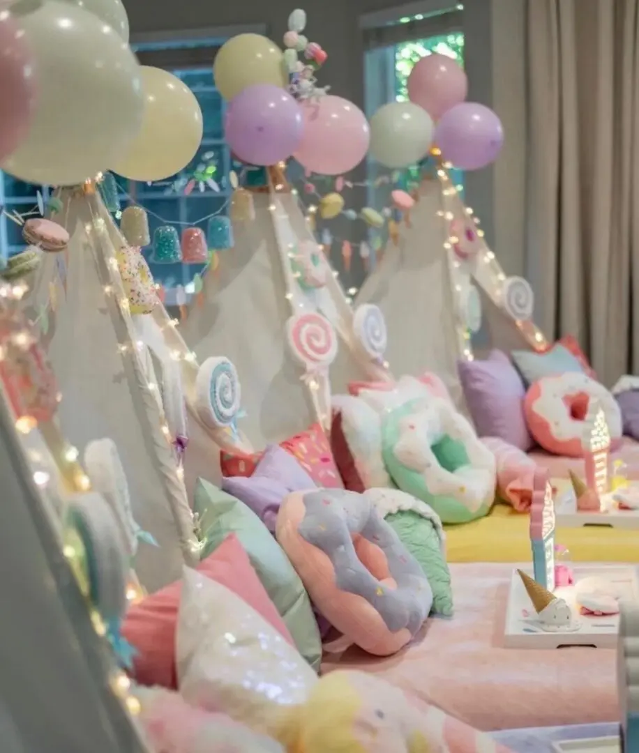 Pastel sleepover teepees decorated with balloons