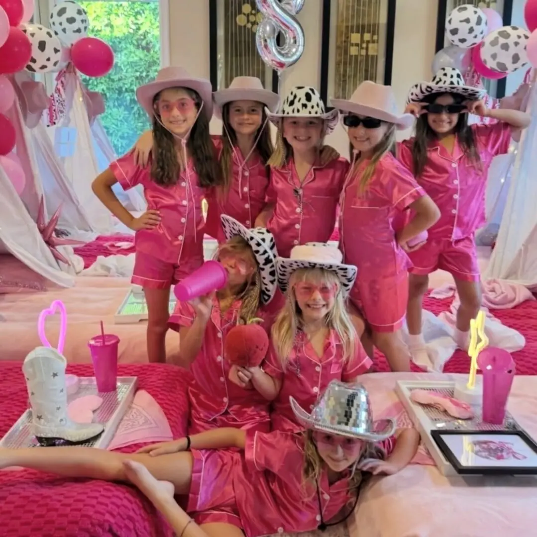 Girls in pink pajamas and cowboy hats