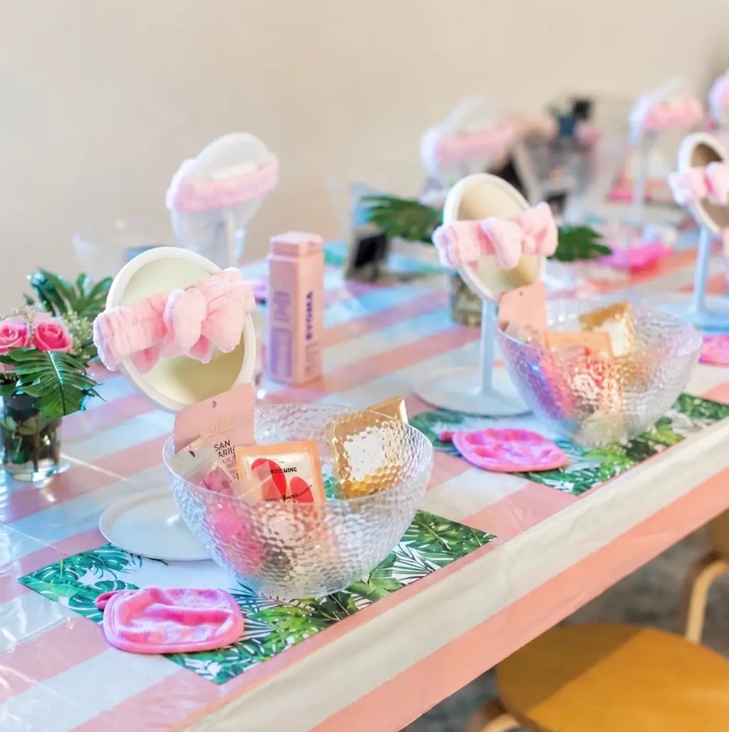 Children's spa party table with pink headbands