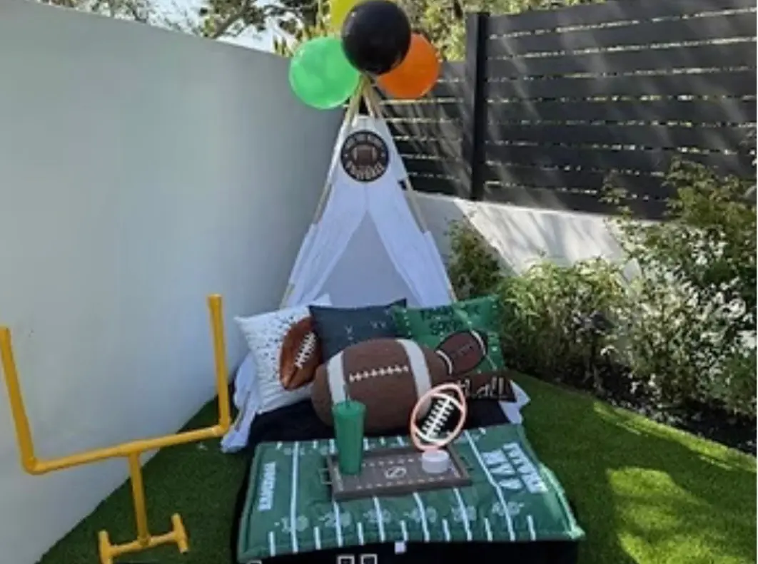 Football-themed kids teepee with balloons and goalpost