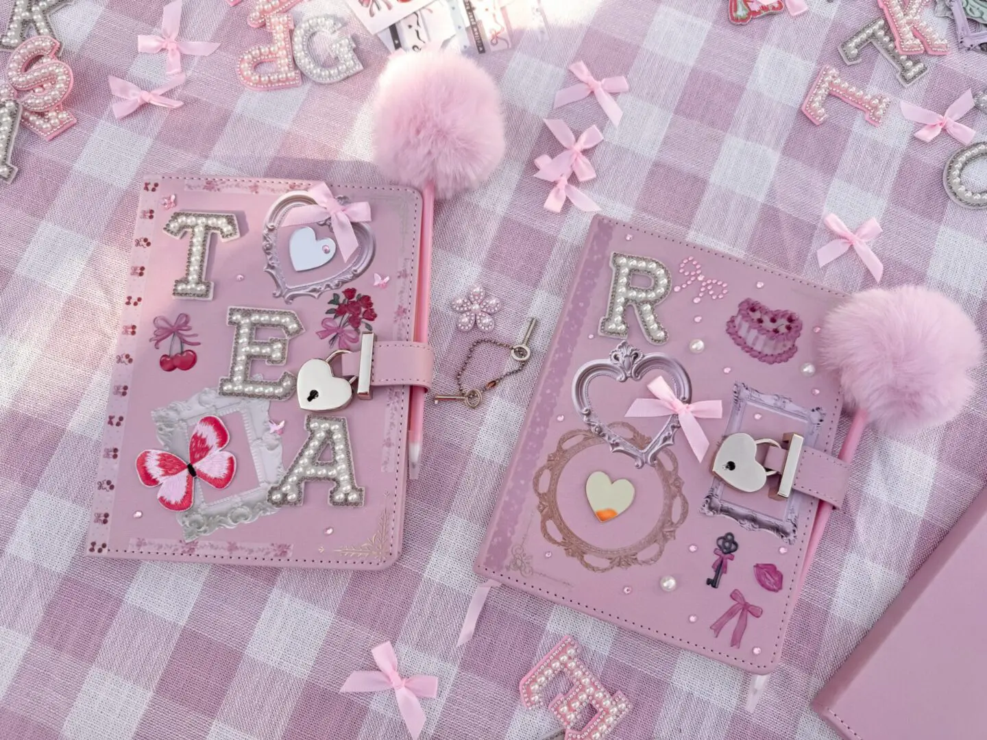 Two pink embellished journals on gingham cloth