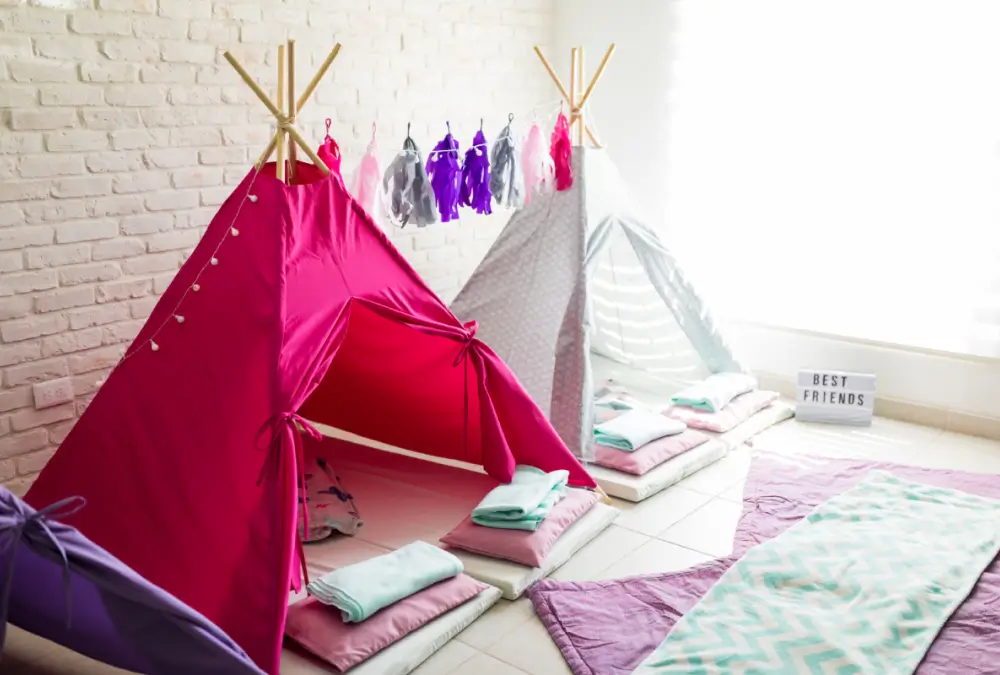 Colorful indoor tents with blankets and pillows.
