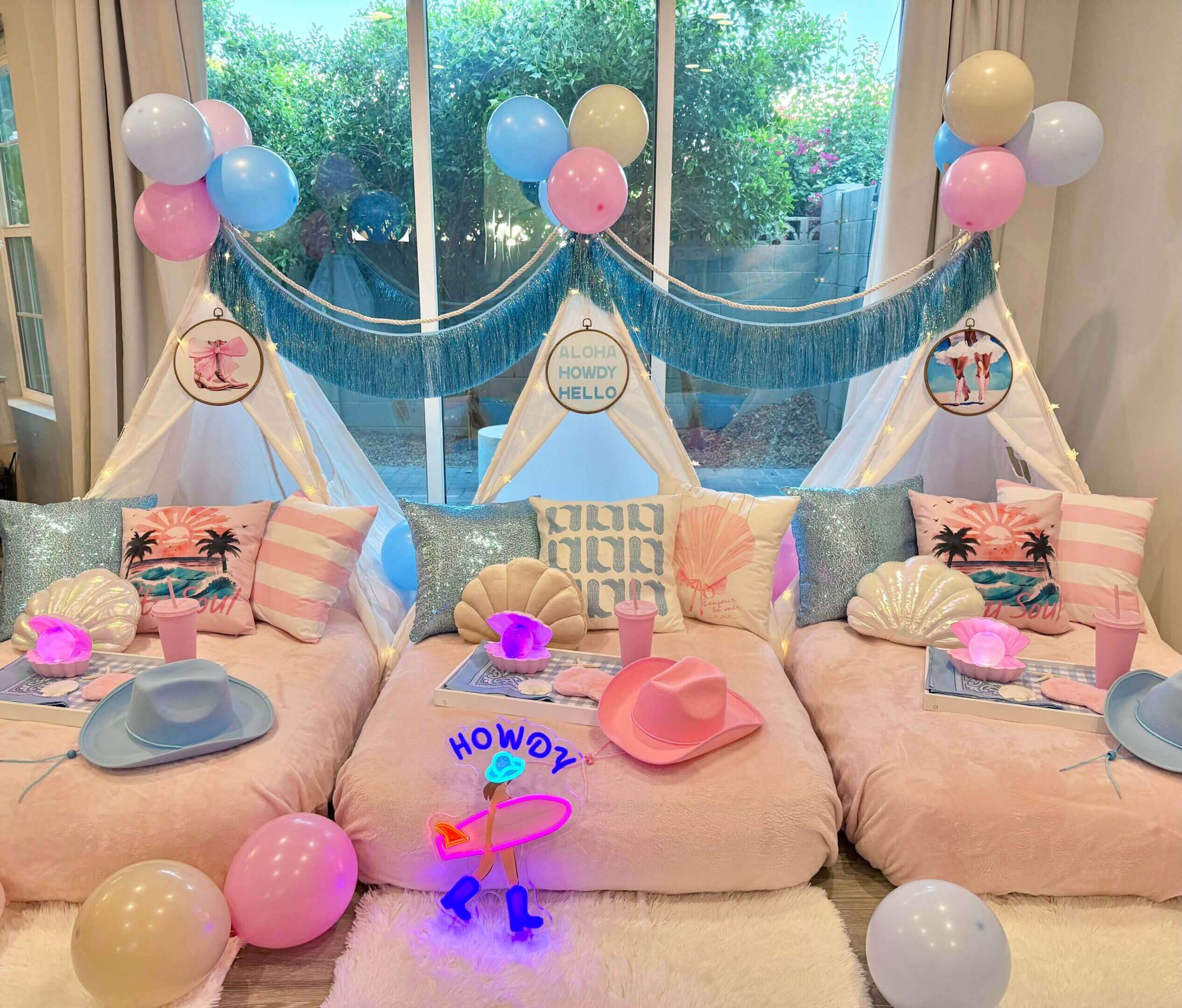 Pastel indoor sleepover teepees with cowboy theme