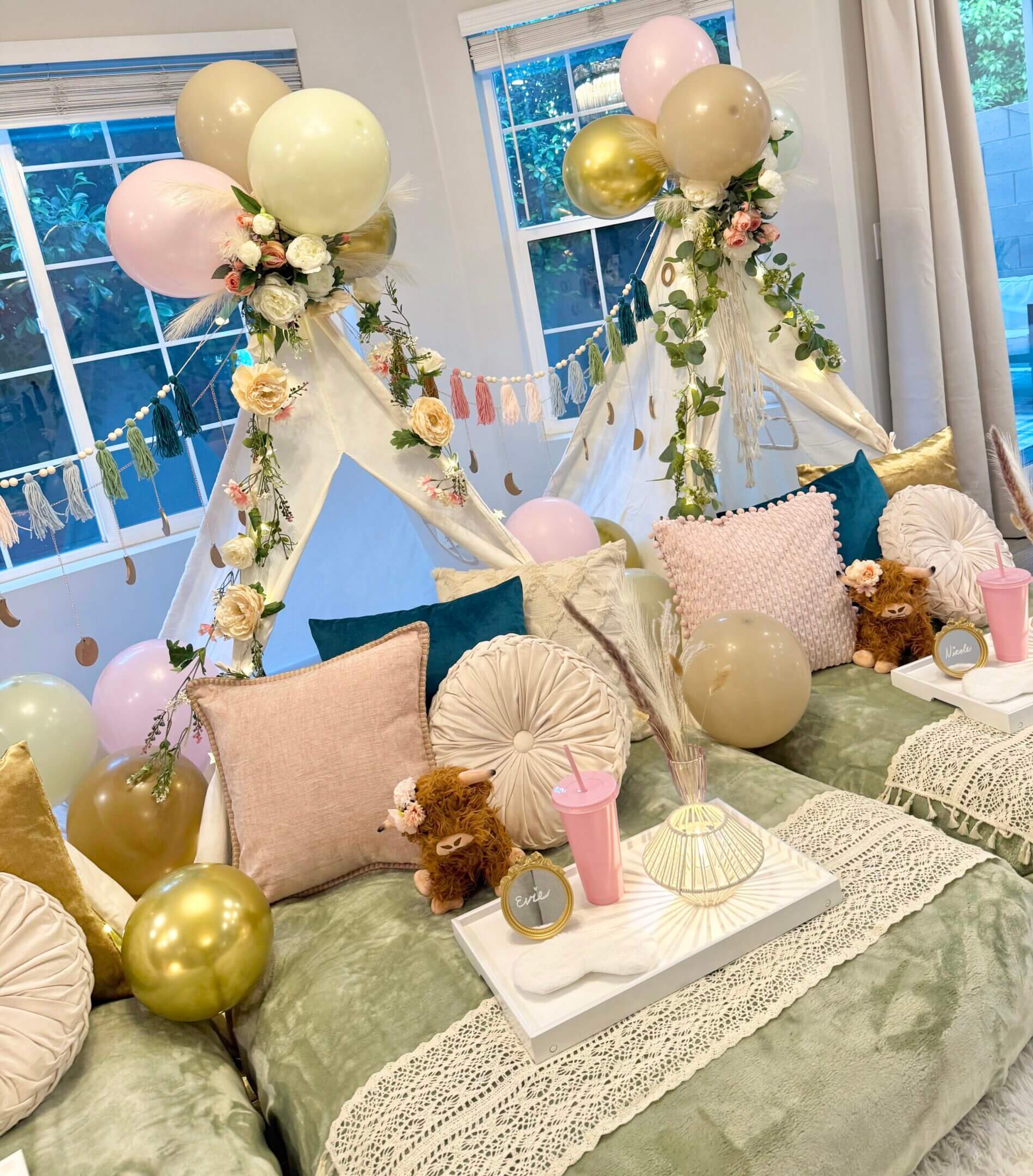 Pastel teepee slumber party with balloons
