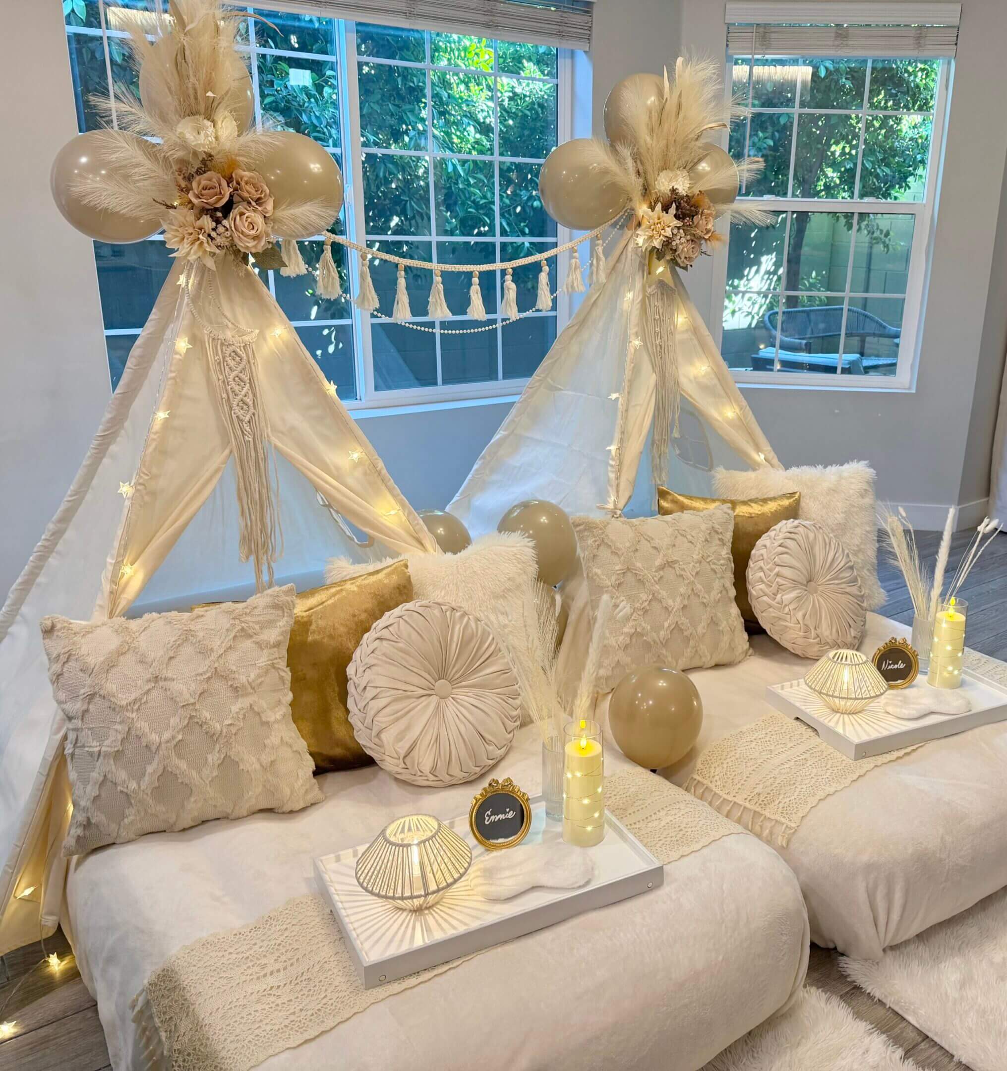 Cozy neutral indoor teepee sleepover setup
