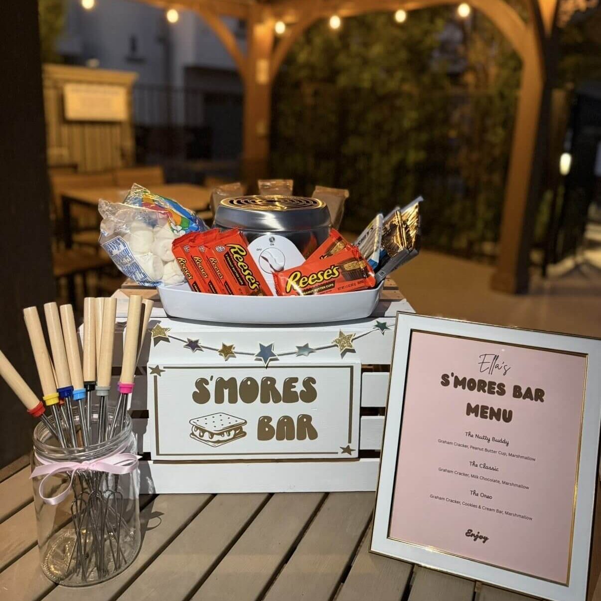 S'mores bar with marshmallows, Reese's, skewers