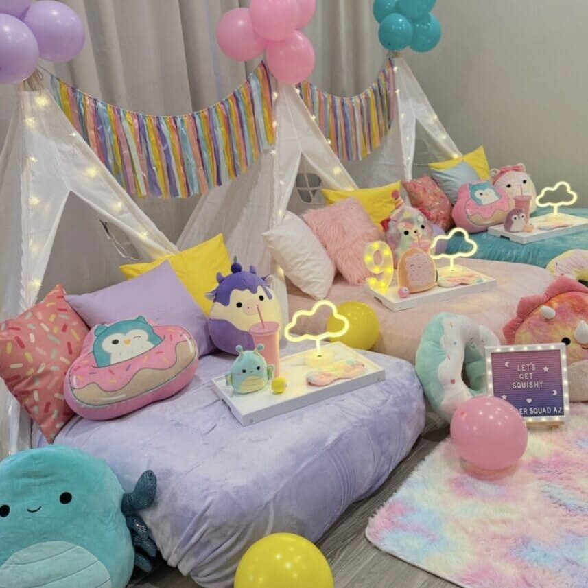 Pastel indoor sleepover beds with plush toys